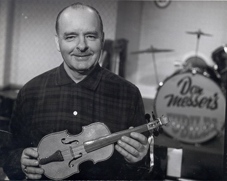 Don Messer holding a fiddle