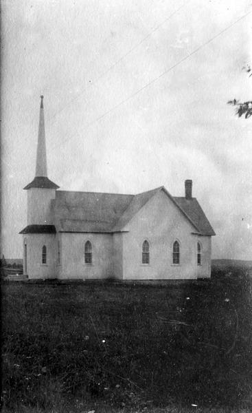 Postcard of St. Andrews United Church. This structure, originally known as Harvey Presbyterian Church, was built to replace the previous building that was destroyed by fire in 1895. The church became known as Harvey United Church from 1925 following the controversial split between Harvey Presbyterians following the founding of the United Church of Canada. From notes written some years ago by Mary Coburn &quot;On August 16, 1931, by a congregational vote the name St. Andrew&#039;s was given&quot;.