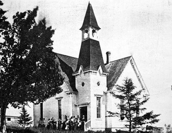 Undated photograph of crowd of ladies in front of St. James Presbyterian Church, Harvey Station, York Co., NB. Image thanks to J.Hall.