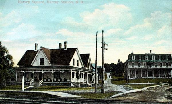 Postcard of Harvey Square, Harvey Station, N.B. View is of Robison Hotel that burned in 1922, and the W.W.E Smith Store , still a landmark in the community. Photographed around 1910. Image thanks to J. Hall.